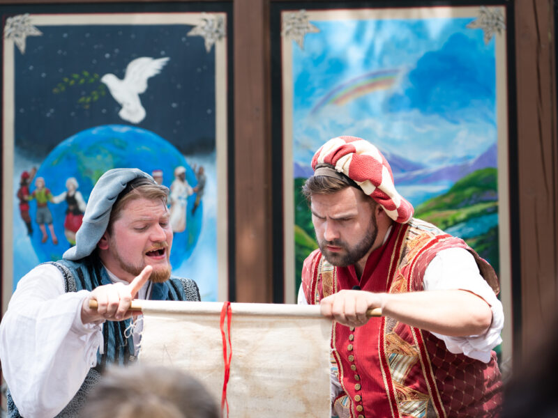 Two actors perform a play during a renaissance faire